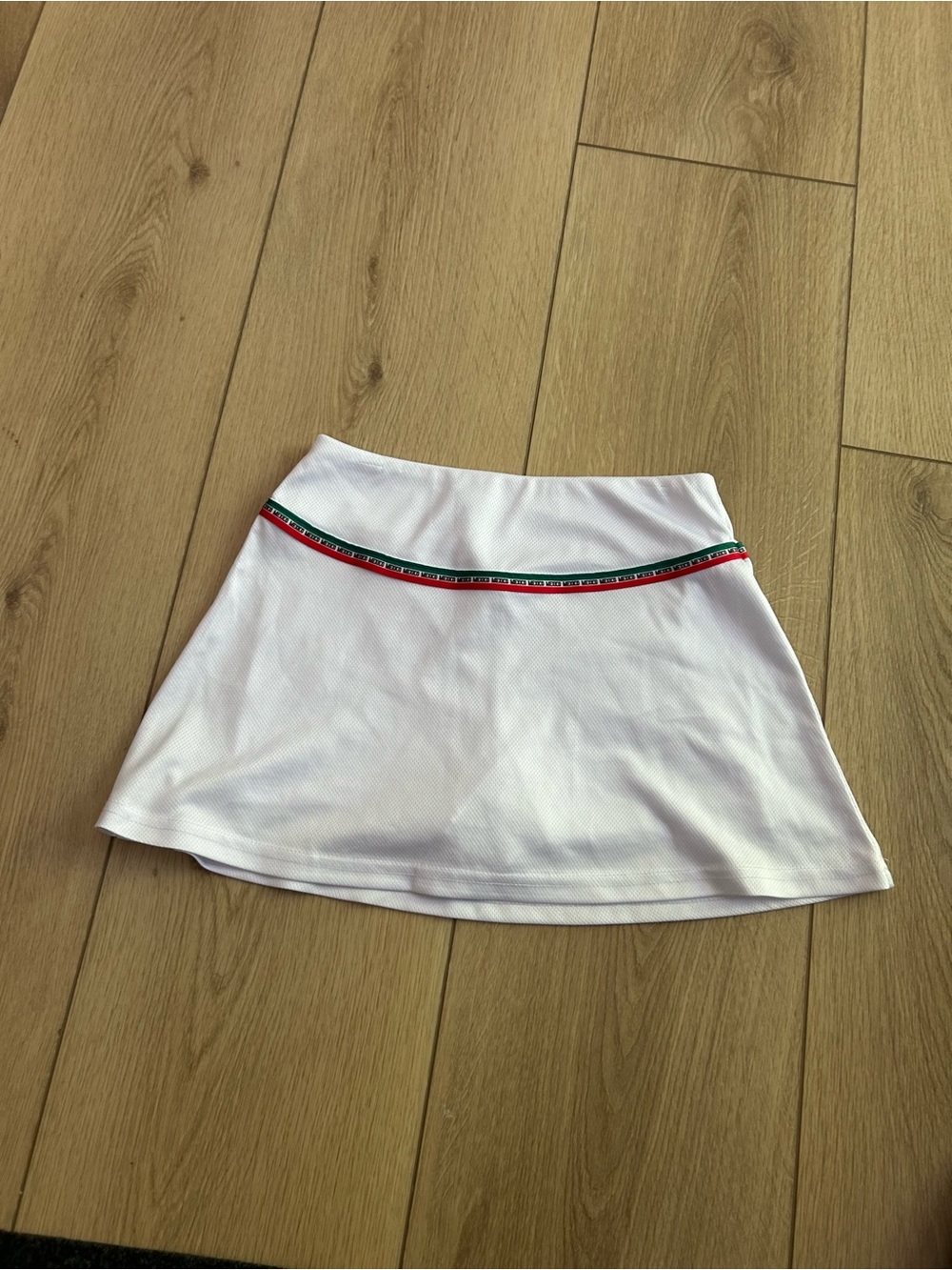 Umbro Carters White mexico skort with Red and Green Stripe